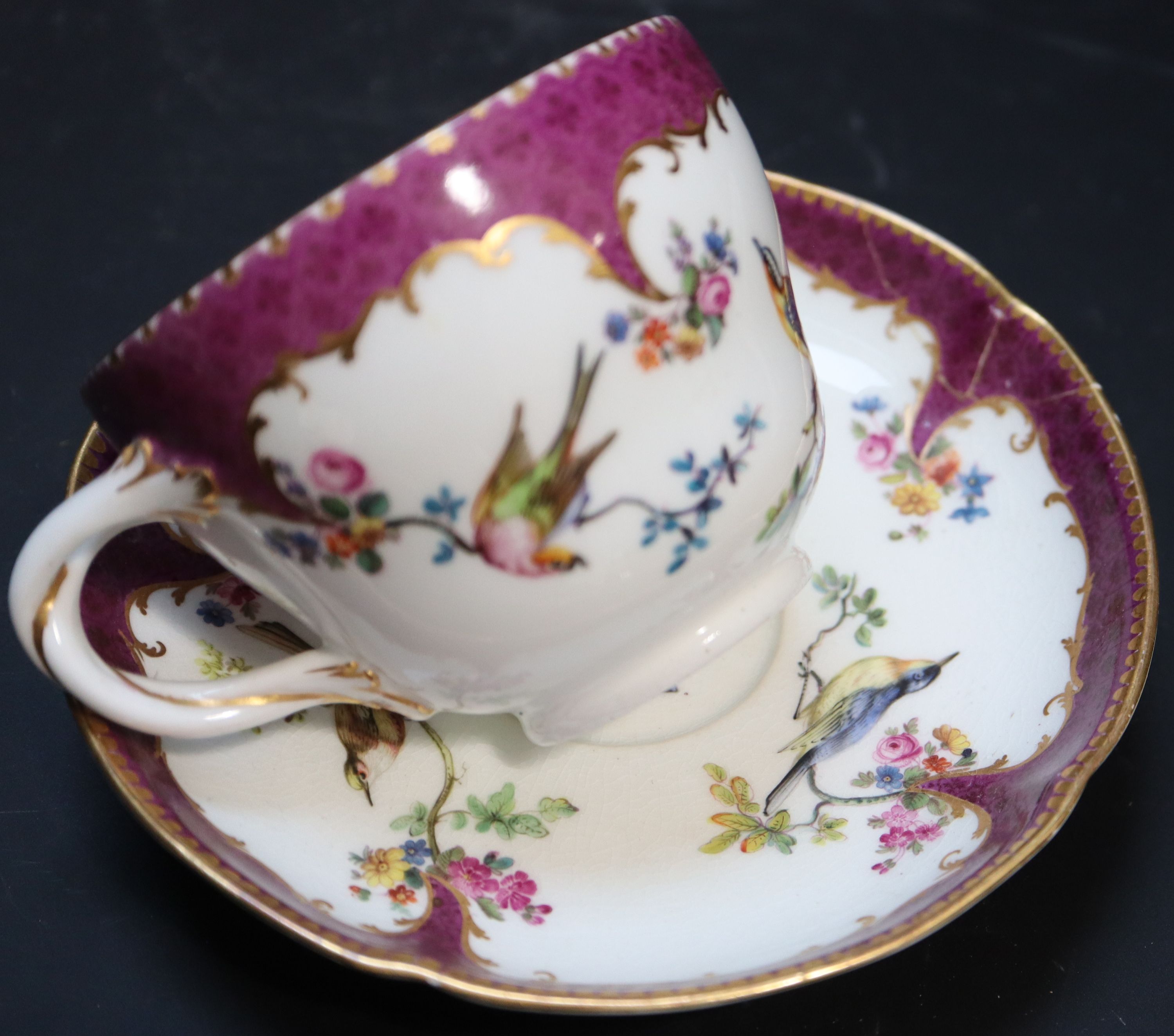 Five Continental porcelain cups and saucers, 19th century,